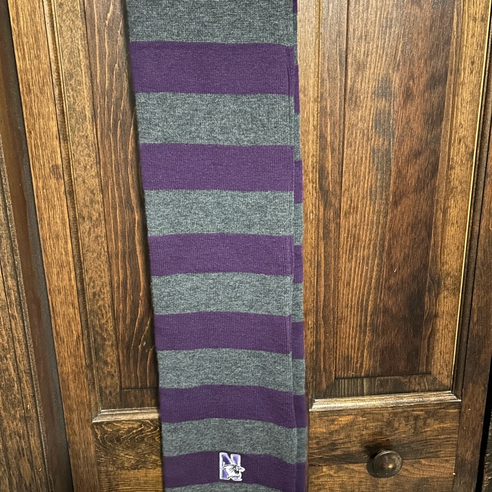 Northwestern University Wildcats purple/ charcoal striped knit scarf.